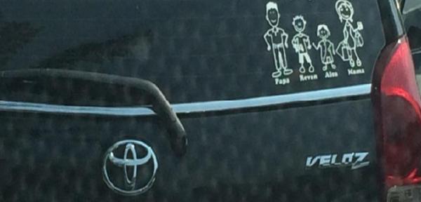 Car back windscreen with family stickers